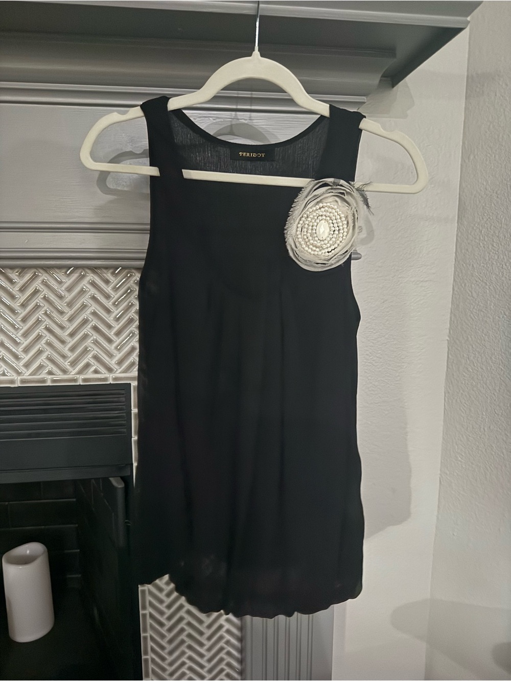 Black Sleeveless Shift Top with Decorative Brooch